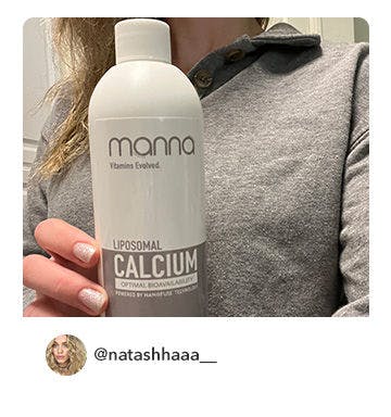 A manna customer holding up a bottle of Liposomal Calcium 1