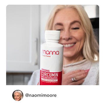 A manna customer holding up a bottle of Liposomal Curcumin with Resveratrol 3