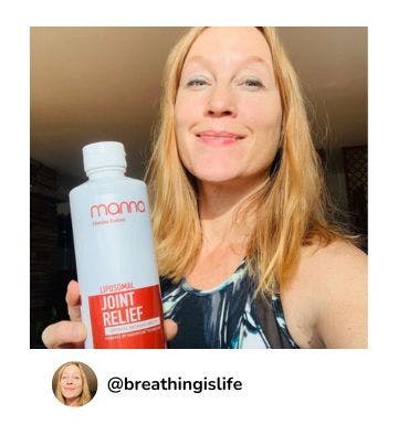 A manna customer holding up a bottle of Liposomal Joint Relief 4