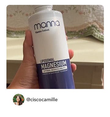 A manna customer holding up a bottle of Liposomal Magnesium 2